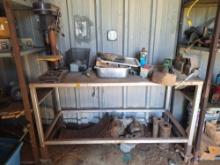 work table with vise and other items