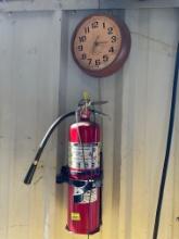 fire extinguisher and clock