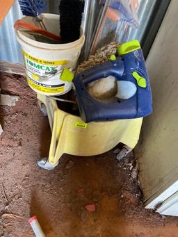 cleaning bucket with scrub brushes and squeegees