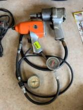 2 1/2 drive air guns and 2 hoses with pressure gauge