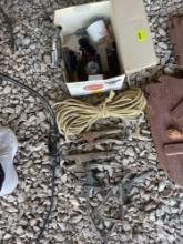 box of rope, tools, oil spout