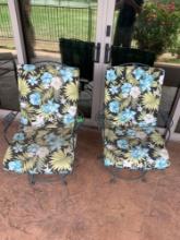 two. Reclining outdoor chairs with pads.