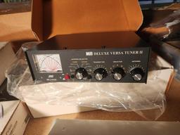 MFJ Deluxe Versa Tuner II HAM radio antenna tuner. New in box and a box of USB cables and DC power