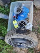 Small spare temp tire, partial roll of barb wire , etc.