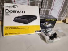 One SeaGate Expansion external add-on storage for PC, and two battery chargers for non-disposable AA