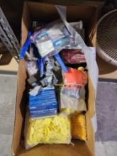 Large box of cattle items. Numbered ear tags Nolvasan S disinfectant, milk feeding bottles, hub