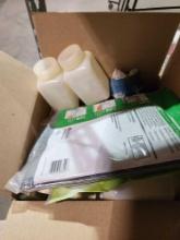 Box of miscellaneous items. Outlet covers, Window air conditioner covers, etc.