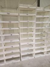 Fifty white plastic stacking bins