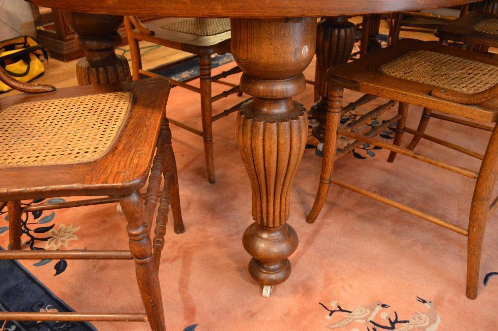 1890's Oregon Furniture Co. 44" Solid Oak Round Dinning Table W/(6) Caned Seat Oak Chairs