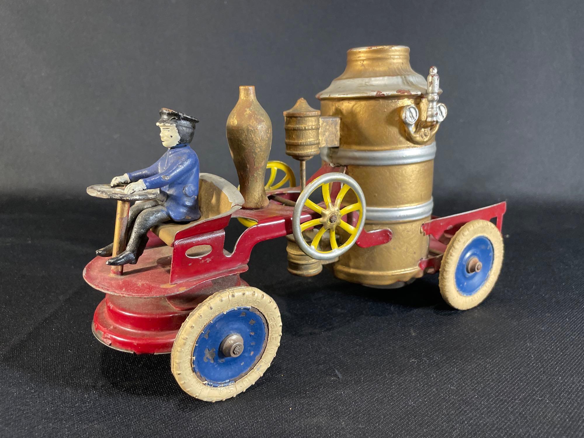 Antique Kingsbury tin windup pumper wagon w/ driver