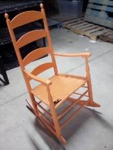 Wicker Bottom Orange Rocking Chair