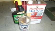 shop lot, gas can, yard sign, water seal and weed killer