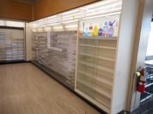 19 FT WHITE WALL SHELVING WITH COSMETICS DISPLAYS 84 INCHES TALL
