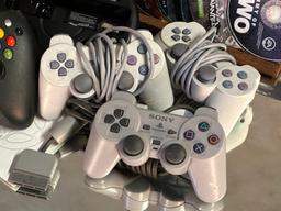 Assorted Game Conscole Controllers with Game Disks