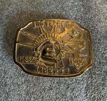 1886-1986 100 YEARS OF LIBERTY BASE METAL SILVER GOLD BELT BUCKLE