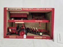 Ertl stock number 429 IH farm set with delux barn IH 886 with three implments