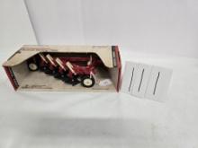 Ertl IH 4 bottom plow in box and box is in good condition stock number 487