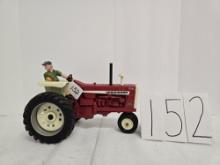 Ertl Farmall 1206 1/16 scale includes man on seat some smudging on tractor no box