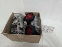 Box of IH toy tractor parts