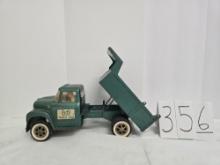 Ertl truck line IH 1600 metal dump truck fair condition with man at seat driving