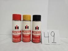 three cans of IH  red yellow and black enamal spray paint