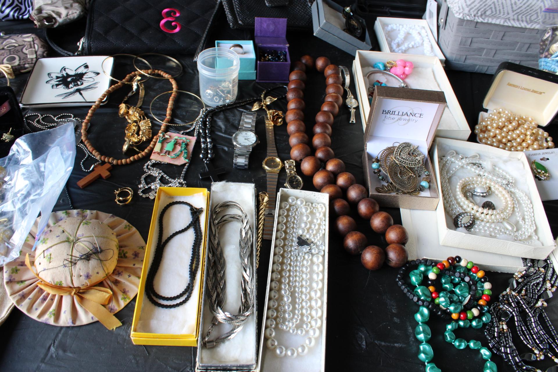 Large Assortment of costume jewelry, coin purses, watches