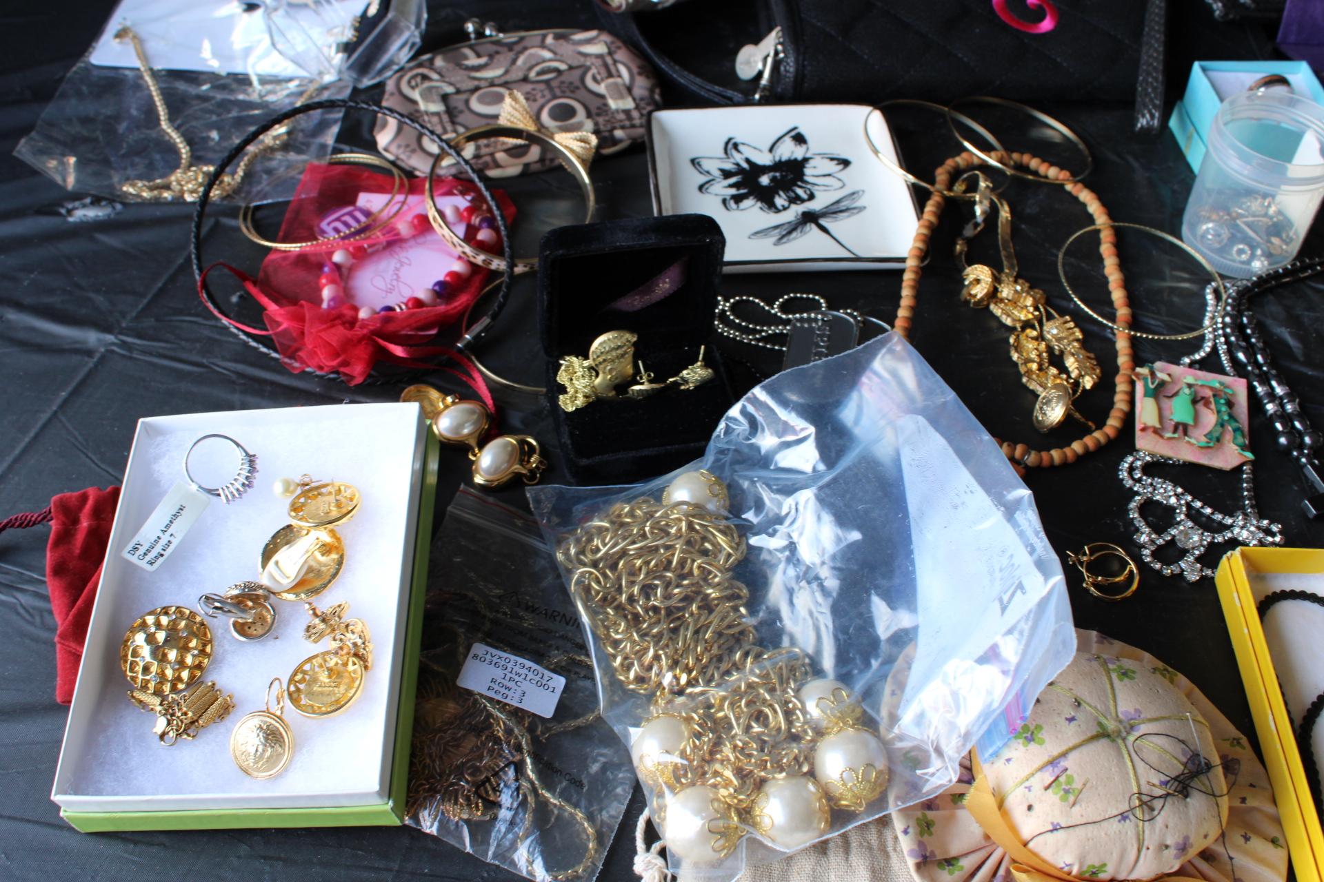 Large Assortment of costume jewelry, coin purses, watches