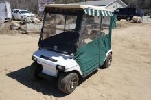 Green and white Club Car golf cart