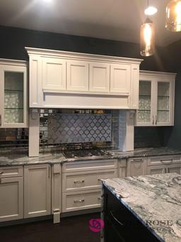 White Luxury kitchen and cabinets display with granite top