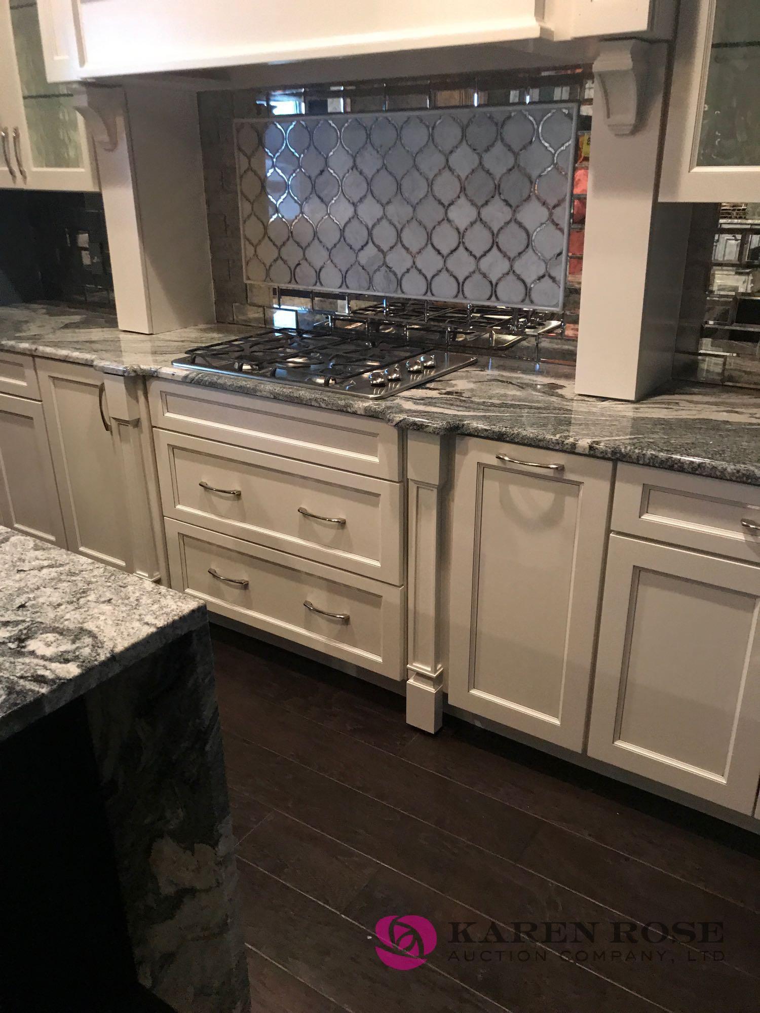 White Luxury kitchen and cabinets display with granite top