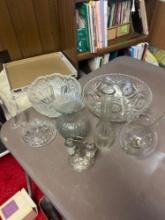 clear glass platters bowls vases in basement