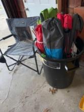 32 gallon garbage can and five folding chairs