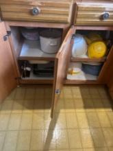 2 contents of kitchen cabinets measuring cups strainers pans and more