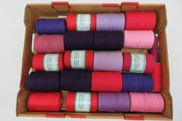 20 spools of Mayville carpet warp, purple, pinks and reds, 4" tall