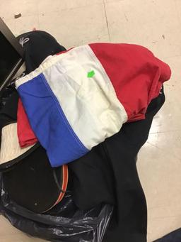 Marching band uniforms and two red white and blue striped flags