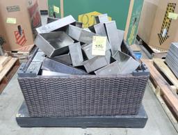 wicker container full of stainless pans