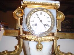 Antique Marble and Bronze clock with female bust at top.
