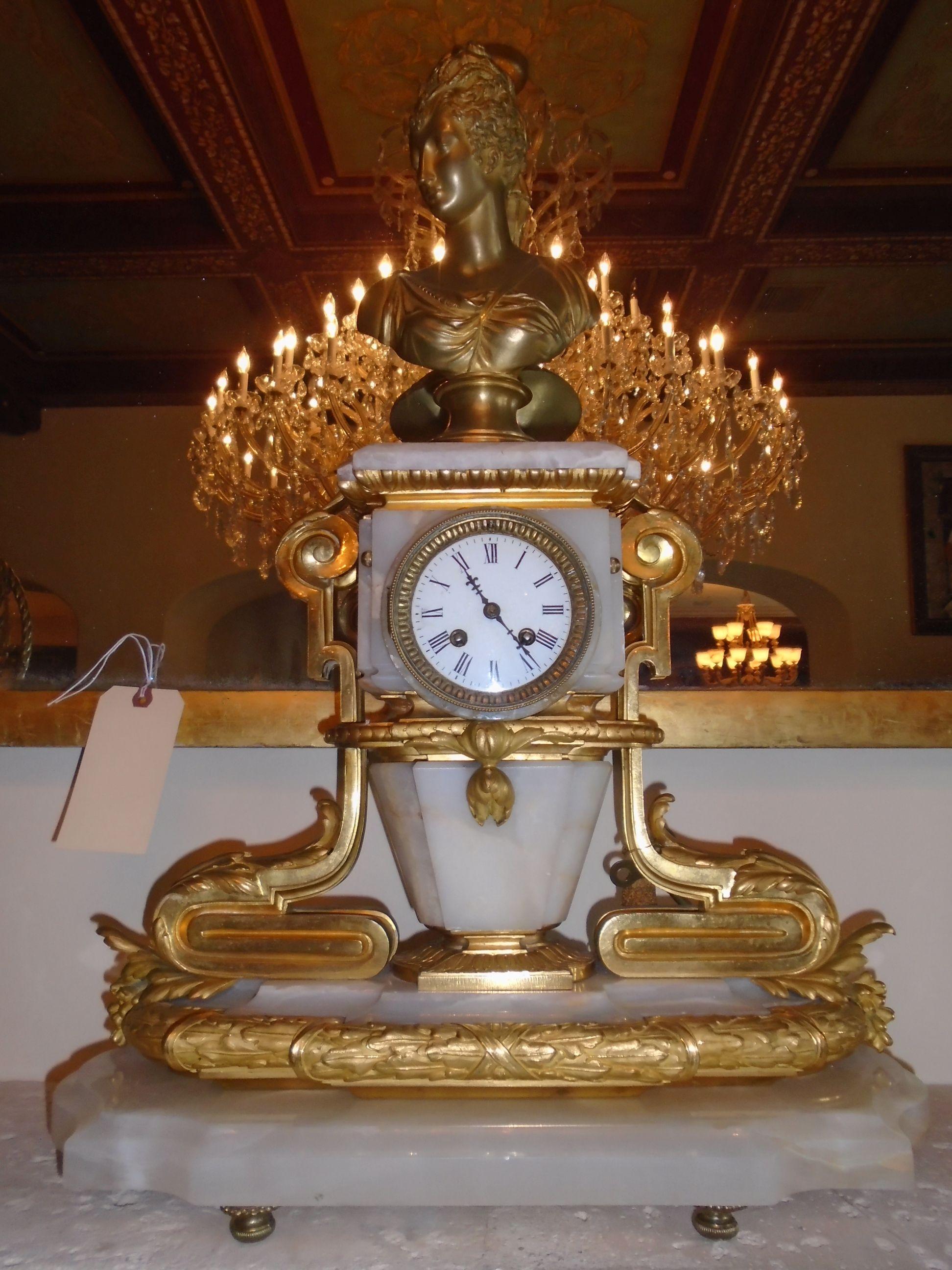 Antique Marble and Bronze clock with female bust at top.