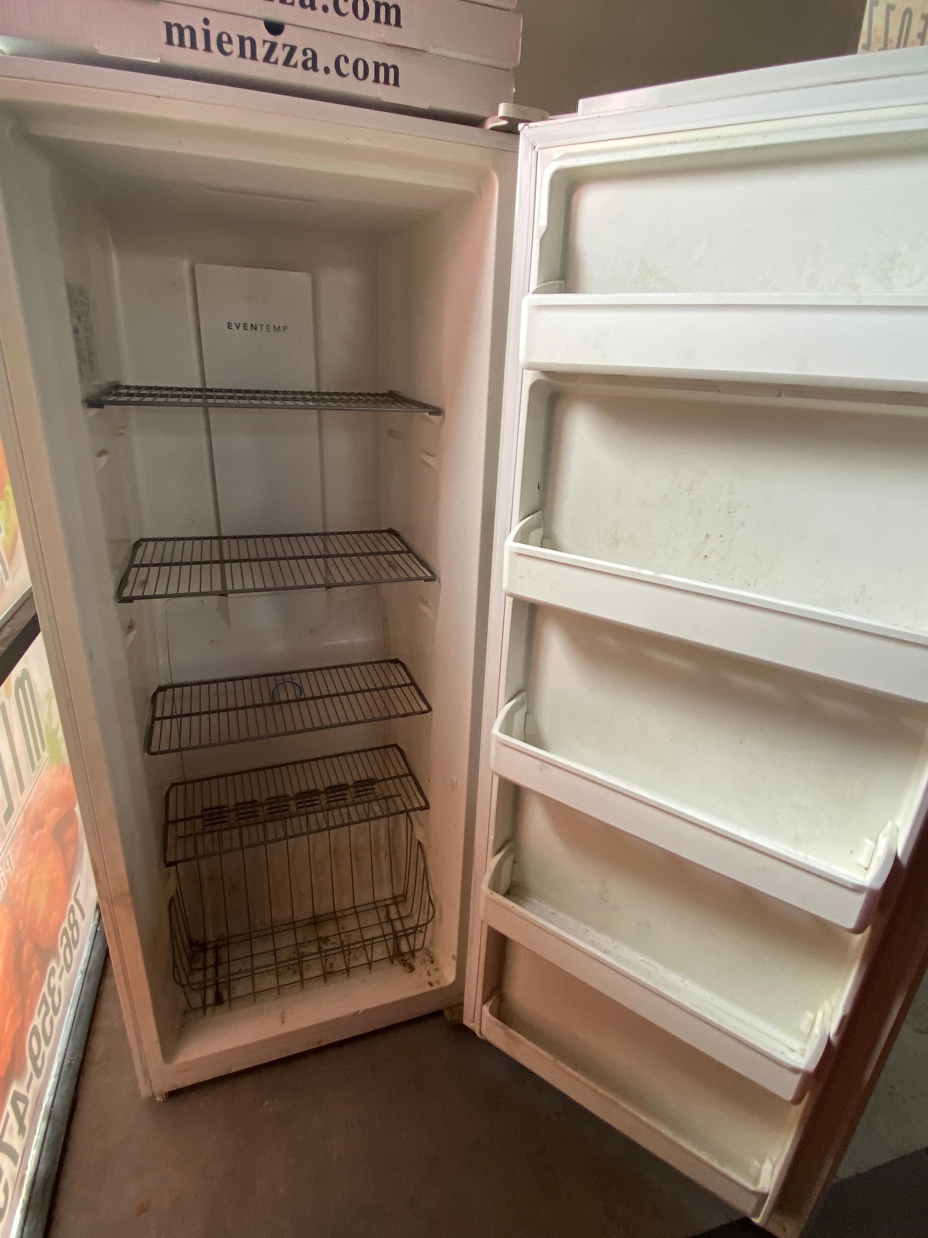 Single door, Frigid Air Freezer with four adjustable, height, epoxy coated shelves, and product bask
