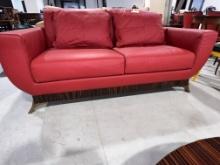 Two Seater Red Leather Sofa with Ebony Makassar Base with Bronze Legs
