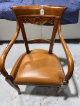 Armchair made in Cherrywood with leather camel upholstery and gold nail head details