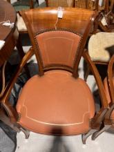 Armchair made in Cherrywood with leather camel upholstery and gold nail head details