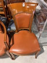 Chair made in Cherrywood with leather camel upholstery and gold nail head details