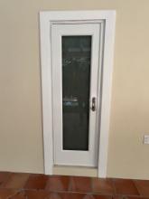 Guest Bathroom Frosted Impact Glass Door withnMetal Design Attached,