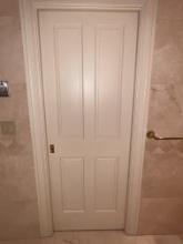 Interior Hardwood Door Into Toilet Area In Master Bathroom,