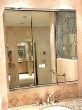 Tri-Fold Chrome and Mirror Medice Cabinet in Master Bathroom