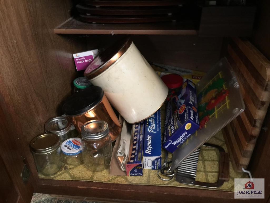 Contents of seven 7 drawers and three 3 cabinets under counter: Dish cloths, cookware, kitchen