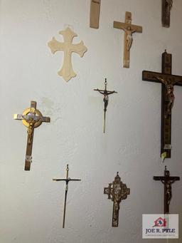 Group of 15 plus crucifixes on wall 8" to 18"