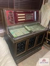 Rowe AMI Jukebox with records and key. Not tested