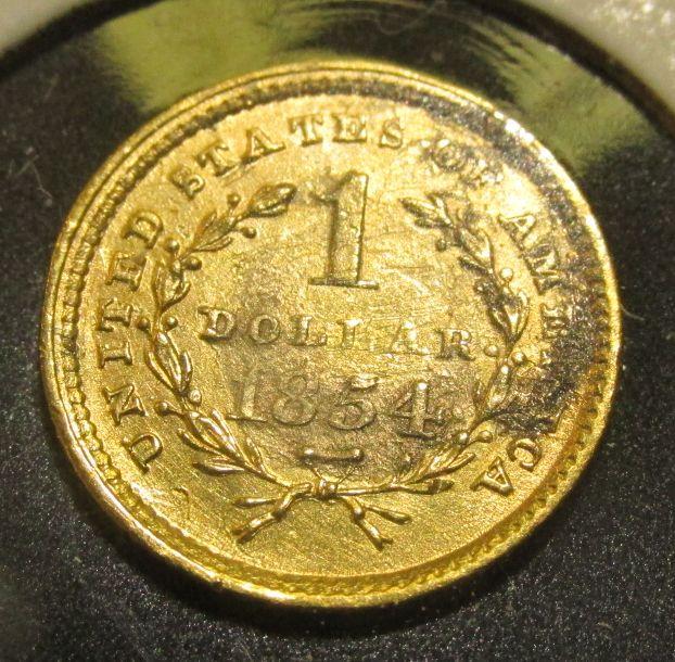 1854 Type One U.S. One Dollar Gold Piece. EF. Solder removed from Date side.